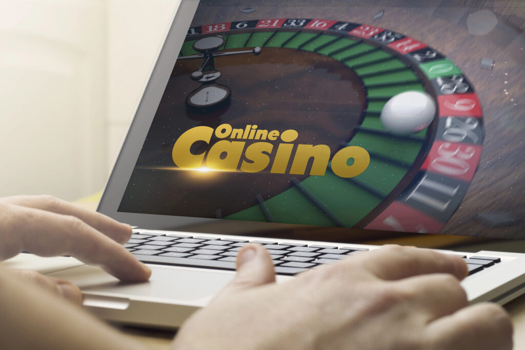 Man using laptop for online casino gaming session