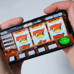 Hands holding smartphone displaying online slot machine game interface